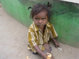 <p>This little girl was sitting by the side of the road alone. We gave the little girl some crackers to eat, but we couldn't find out where her parents were.</p>