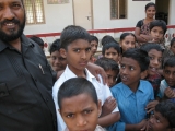 <p>The boy in the white shirt is named Amos. Amos’ father died around the time Amos was born, leaving him and his older brother alone with their mother. His mother chose a Biblical name for him even though she wasn’t a Christian. She heard that the name was Biblical, and decided her boy would be taught about Christianity. His older brother had not been given a Christian name, and had been educated in a government school. She decided to send Amos to the Balm of Gilead school at the orphanage to get a proper education. Shortly after Amos enrolled in the school, his mother was hit by a car and killed, leaving Amos an orphan. Ironically, he was already in the orphanage, and getting a Christian education just as his mother had wished. Amos still grieves for his mother, and is coming to terms with his loss. What a miracle that this mother’s foresight placed this young boy in the right place at the right time.</p>